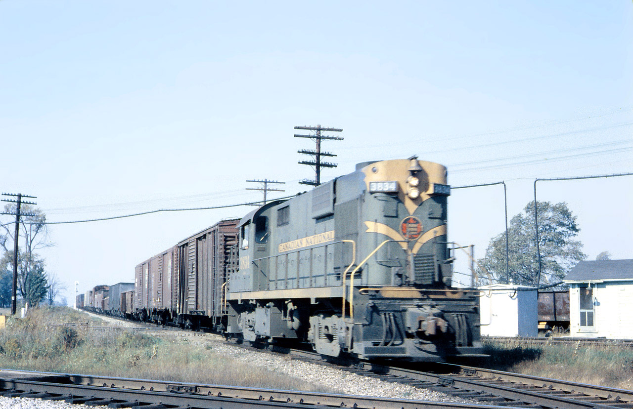 CN 3834 looks to be timetable Fourth Class freight 790, the Dunnville Sub roadswitcher. The train is heading back to base at Fort Erie with a mixed bag of cars ( the wooden outside braced box might be a CV ).
Note the screen door on the NYC office, and the gondola parked in the connecting track, likely for MofW use.