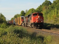 On a beautiful early evening in late August, a CN westbound (CN 383 or 399) hustles a lengthy train south on the Halton Sub then west on the Dundas Sub. Power was CN 8804 and CN 5716 up front, and mid-train DPU CN 8860.