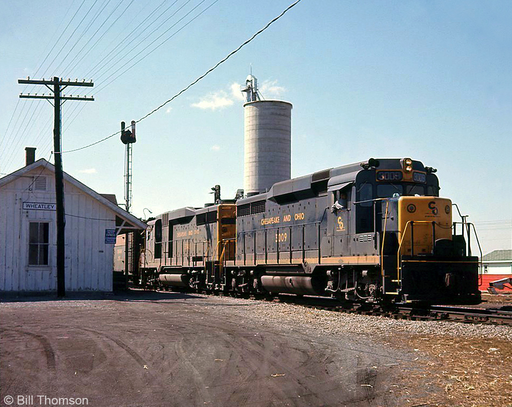 A pair of Chesapeake & Ohio EMD GP30's's with C&O 3009 in the lead head eastbound on C&O Sub 1 past the station at Wheatley ON, in 1966.More C&O action nearby:A trio of GP30's waiting by the station at Merlin ON: http://www.railpictures.ca/?attachment_id=15429Two trains meeting with solid GP30 consists: http://www.railpictures.ca/?attachment_id=14951