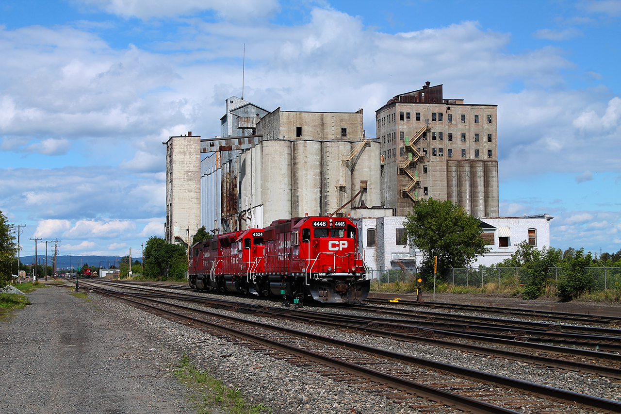 GONE...but not forgotten... Grain is a major commodity in the West. It was either shipped, or transported by rail. For the City of Thunder Bay, neither industry has been kind in recent years. Thankfully, the City is still a major division point for the Canadian Pacific. Here, CP 4446 is on the tail end of a remote-controlled trio of engines that are testing and will be working the yards located a little further East. As evident in the background...an abandoned grain building and former docks where the ships used to come. Also notably missing, VIA Rail.