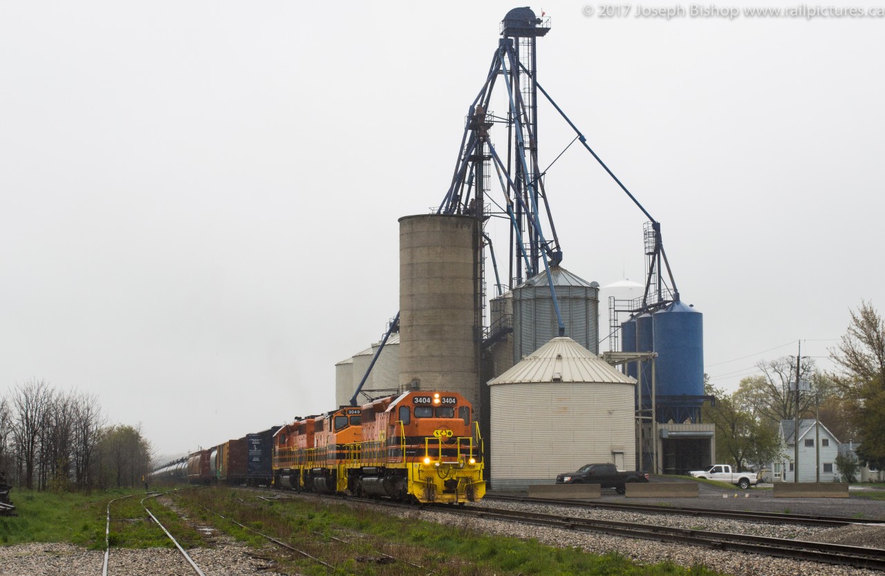 RLHH 3404 leads a very late running 597 through Hagersville Ontario on a dreary and rainy Friday at 1300.  SD40's 3404 and 3403 along with GP40-2W 3049 had a massive train of 80 cars in check as they blasted through town.  I was questioning my sanity standing in the rain and I'm sure the crew was too, but it was worth the drive to Hagersville.  A timely heads up from my sister that 597 was in Caledonia provided me with enough time to catch up to train.