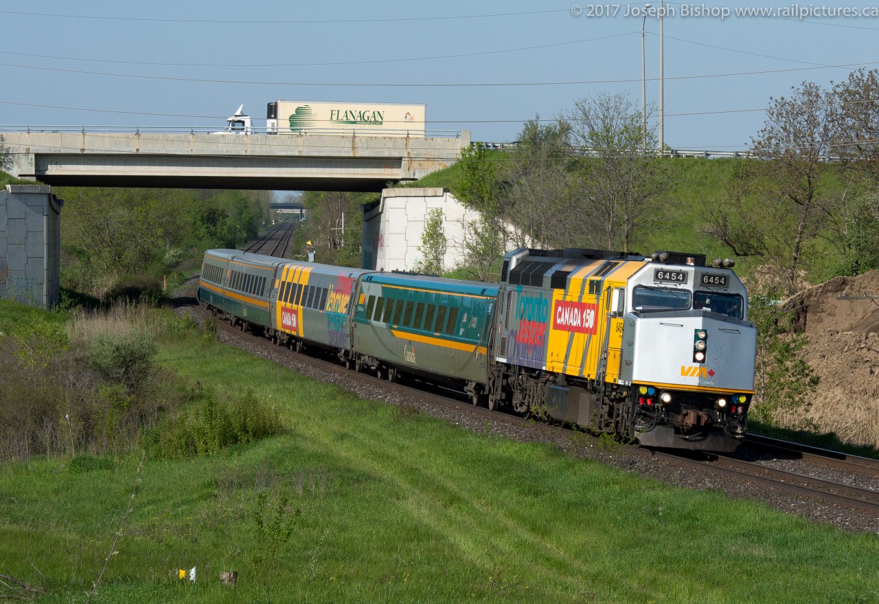 Via 6454 leads train 70 by Garden Ave just outside of Brantford on a sunny May morning.  6454 is one of 5 wrapped F40's on the Via system, they've been floating all over the Via system lately, some on long haul trains and others on commuter service.  This was a surprise this morning as I was out for other reasons and a quick stop yielded a shot I am quite happy with.