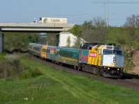 Via 6454 leads train 70 by Garden Ave just outside of Brantford on a sunny May morning.  6454 is one of 5 wrapped F40's on the Via system, they've been floating all over the Via system lately, some on long haul trains and others on commuter service.  This was a surprise this morning as I was out for other reasons and a quick stop yielded a shot I am quite happy with.