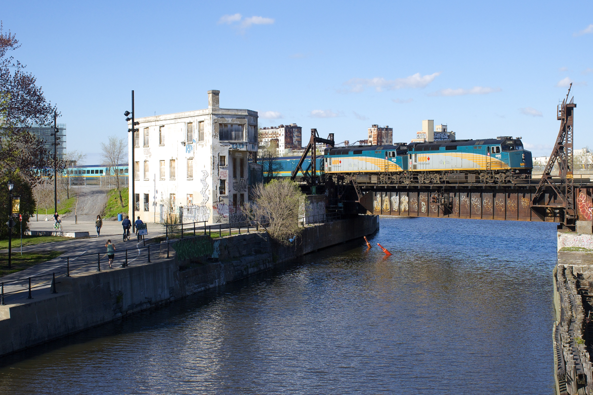 VIA 6405 & VIA 6426 push VIA 14 (the Ocean) past Wellington Tower about an hour and a half before its departure from Montreal's Central Station.