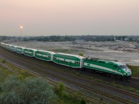 GOT 605 has ten cars in tow as it heads through Whitby. The overpass I was standing on (Hopkins street) was on its last days at time, with a new GO Transit facility (being worked on in the background) causing the overpass to be demolished in 2016.