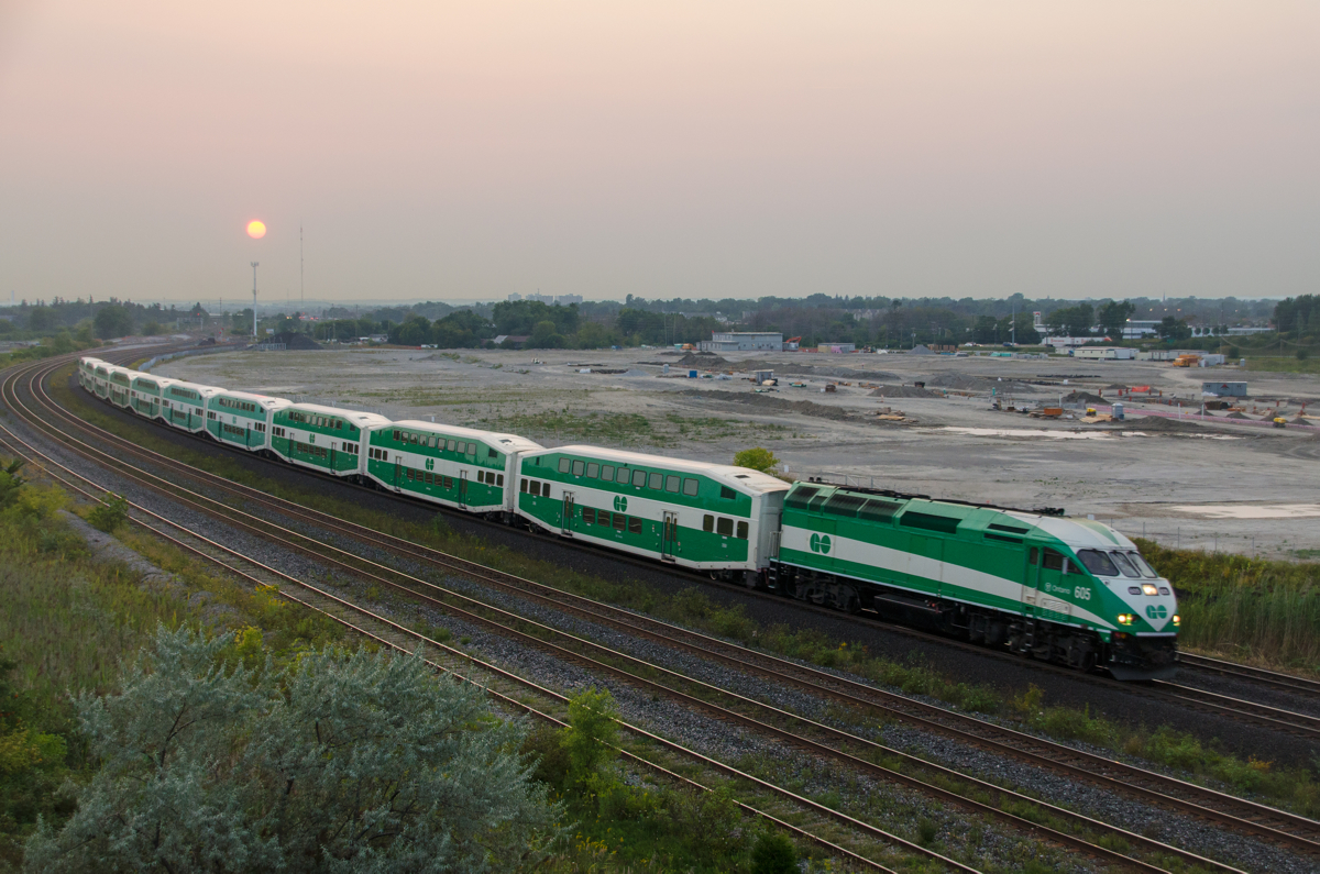 GOT 605 has ten cars in tow as it heads through Whitby. The overpass I was standing on (Hopkins street) was on its last days at time, with a new GO Transit facility (being worked on in the background) causing the overpass to be demolished in 2016.