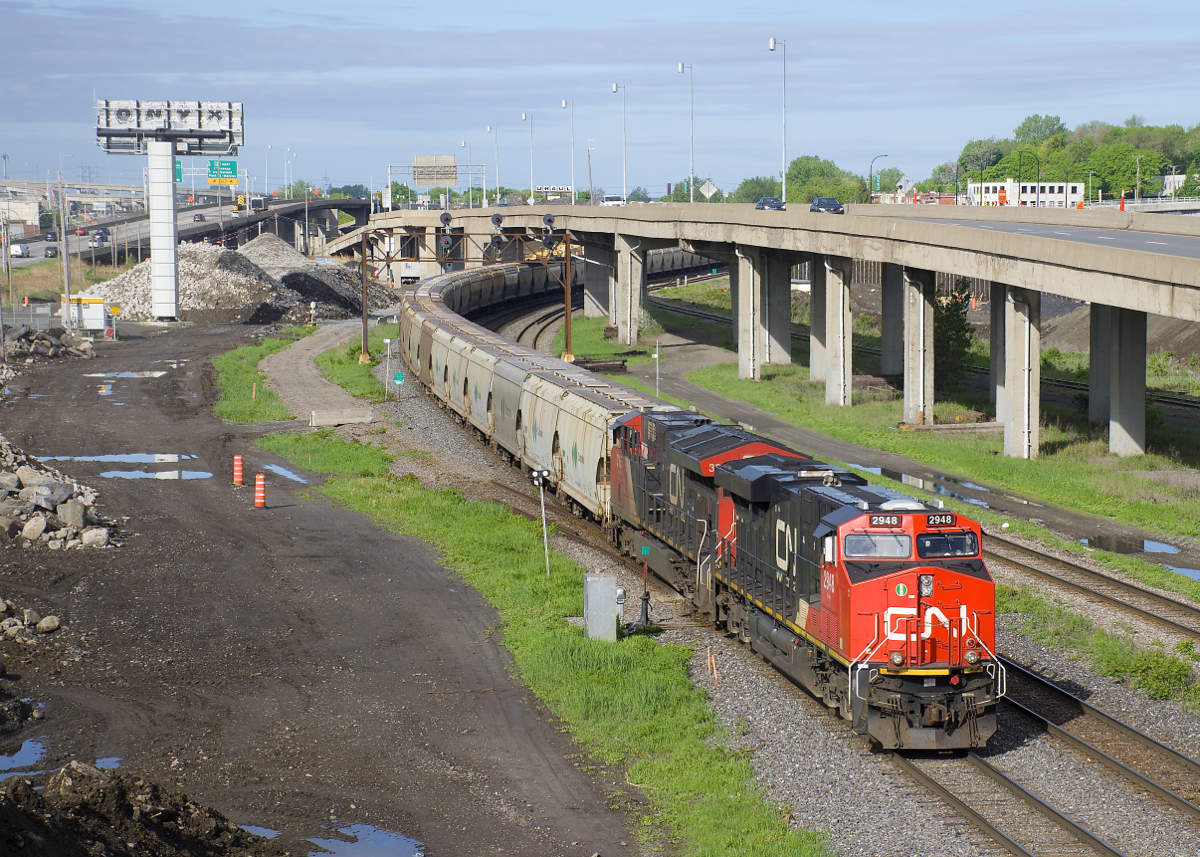 With 205 loaded potash cars and a train weighing close to 30,000 tons, CN B730 has just left Turcot West after changing crews. Power is 4 AC units with CN 2948 & CN 3065 and CN 2876 & CN 2887 mid-train.