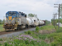 After supposedly hitting something East of Kent Bridge in a "bouncy unit" as described by the crew, the diesel doctor recommended that the weed spraying train to stop at a crossing friendly location to be inspected by the mechanic that was in the area. Here they are stopped on the main waiting for the mechanic with D&H 7304 in lead 