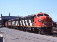 A Mike McIlwaine photo.
A matching ABA set of F7's idles at CN Stuart Street engine facility, awaiting their departure on 'The Nanticoke Steel' run. Soon they'll be gingerly tip toeing on the Ferguson Avenue street running as they make their way through the south end of the city, and climb the escarpment towards Rymal, Caledonia and beyond. A lot of things in this photo are gone. But thanks to Mike, and others, we can see what used to be. How these units came to Hamilton is an interesting story ( for non-employees ) - they were no longer required at places like Prince Rupert and Edmonton, so the Assistant Manager of Motive Power asked the Hamilton shop foreman if he would be interested in having 2 ABA sets based here. To his surprise the Foreman said 'Yes' and the rest was railfan heaven !