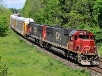 CN 394 cruises through the "S" curve at John Avenue in Paris, ON with IC 1008 - IC 1012, and 106 cars