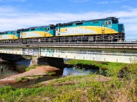 Via rail 6412 leads a passenger train across the salmon river before making a quick stop in Truro before heading to its final stop in Halifax 