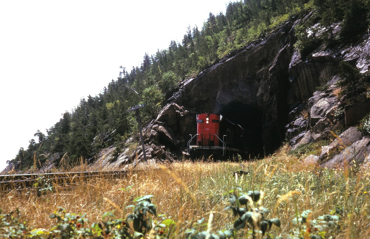 An excursion with a pair of RS-18s performs a runpast through the short tunnel between baie St Paul and Pointe au Pic.