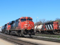 This eastbound is rapidly following the lunchtime VIA on the adjacent track. It is a mixed freight with over half of the consist being Autoracks. Sister loco CN 2930 is helping!