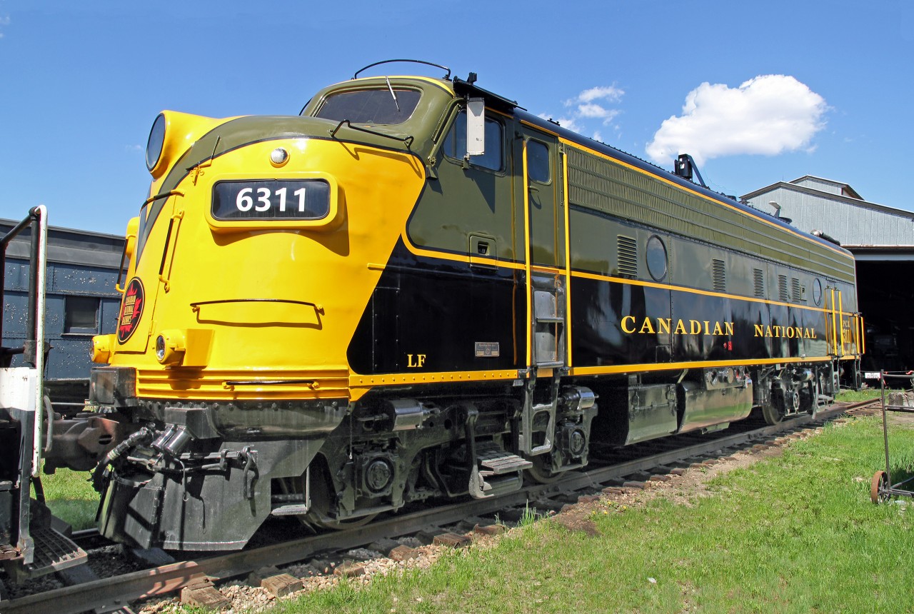 Not in a great display location FP9Au CN 6311 sits on a back track at the Alberta Railway Museum.  The locomotive is privately owned and apparently registered as RPCX 6311.
