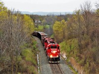 This was the return trip headed north from Hamilton of the management train with an assorted trio of CP power in (GP20C-ECO) CP 2278 leading, with (SD60M) CP 6258 and (SD40-2) CP 6017 for assistance, after they had picked up loaded ballast cars and several gondolas of used ties and head under the Newman Road overpass