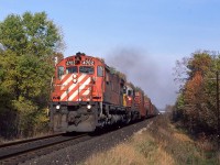 Once again we find CPR leasing power. Among other things, they borrowed ACR units 180, 182, 183 and 185 that year. A westbound shot at Springwell Road ( 1 mile west of the 402 overpass) with 4702 and leased Algoma Central SD40-2 183. It’s upgrade through here and the leaves on the rail were giving this guy a little trouble.
