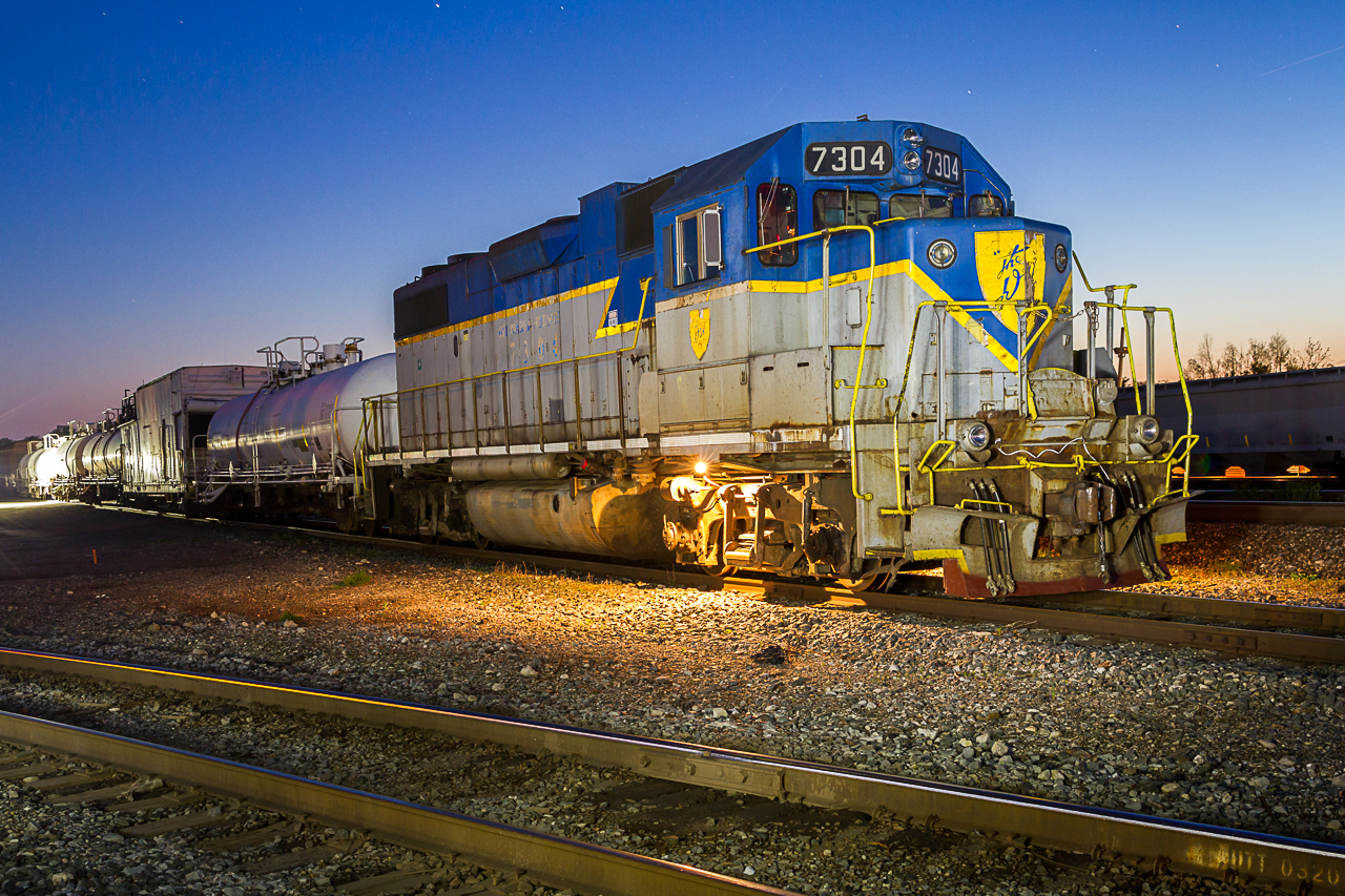 Lightning Stripes Under The Stars:  As twilight turns to dusk, a veteran GP38-2 in original Delaware & Hudson paint slumbers with the spray train at Guelph Junction. Thanks to all the folks who provided the lighting for this shot, you know who you are.