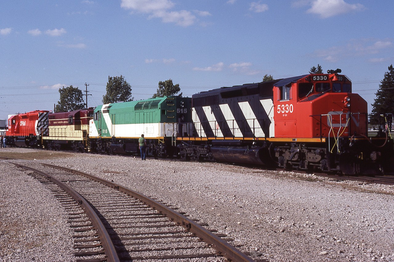General Motors Diesel open house, September 24, 1983. On display for the public were examples of the plant's production, new and old, locomotives and otherwise. Out front where traffic passing by on Oxford Street could see them, were these 4 engines - CN SD40-2W 5330; GO F40PH 515; TH&B GP7 74; and CP SD40-2 5584(2nd). Except for the GP7, all are brand new. (CP 5584 is a replacement for the first one, wrecked and scrapped). Interesting to note that GO 515 went to Amtrak, became 415 and then went to the Panama Railway renumbered to 1861. But, how could I have known that could happen, as I waited for most of the FOAMERS to move out of my way....??