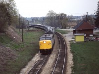 Not the greatest of exposures on an overcast day but the overall location is one for the books. Train 75 with a good consist coming off the Grand River trestle, crossing overhead of Grand River Street and passing the forlorn CN Paris station while curving beneath the John Street overpass.