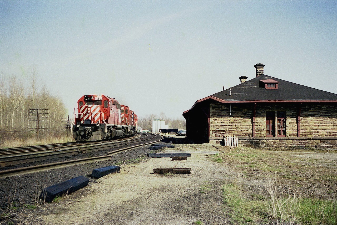 The old Perth CPR station has already been decommissioned by the look of it. CP 5738, 4507 and 47xx west roar by what I considered an unusual designed station (read: ugly) of which there were probably more of it's type but offhand I cannot think of one. Unfortunately this image is shot on substandard print film I used 'back in the day' and this is about as good as it gets. Now, not only is the station long gone, Perth, being within 11 miles of Smiths Falls, doesn't even get a timetable mention.