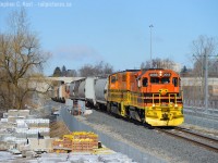 And a view ever changing in Kitchener-Waterloo - GEXR 582, on the first day of the change of card is seen waiting at South Junction for LRT Construction foremen to allow the train to proceed into the CP/GEXR (CN) Interchange yard. In the background, fresh wires were recently strung on the double main track ION LRT line which should start testing in the next couple of months. If one was ever to shoot a freight and LRT in the same place, this would be the place to go, that is, provided you can find the once a day freight move to the Interchange - sometimes it's at night.<br><br>Change of card you say? Well, put it this way, on GEXR symbols move with the crew, and don't necessarily mean origin or destination of train. 582 is now Continental along with 432/1, ordered 7 days a week, but Monday-Friday ordered out of Galt, and Saturday/Sunday out of Kitchener using whatever power is found at each terminal. 