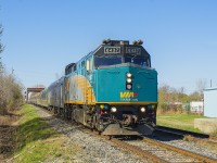 Sass Road Crossing in Chatham hasn't changed much. After all, there are still 2 tracks to cross, although the former westbound main does not continuously exist - only sections remain intact. But 32 years prior...a man who had a love for the railway, stood at Sass Road and captured the same train 72. The westbound main was still quite intact then, and  I think the surprising factor in comparison to now, is that VIA train 72 still seemed to have at least 7 cars in it's consist. I'd like to pair this photo with <a href="http://www.railpictures.ca/?attachment_id=29069"> Bruce Mercer's photo that was taken in 1985 </a> for the Time Machine.  