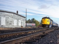 Nearing a station stop in Chatham, VIA 6525, with a 3-car Toronto-Windsor train 71, approaches the diamond with the C&O's Canadian Subdivision No. 2 at mile 61.6 on the CN's Chatham Sub. To the left is the old C&O engine house and the interchange track with the CN. The McGregor Creek bridge is in the background.