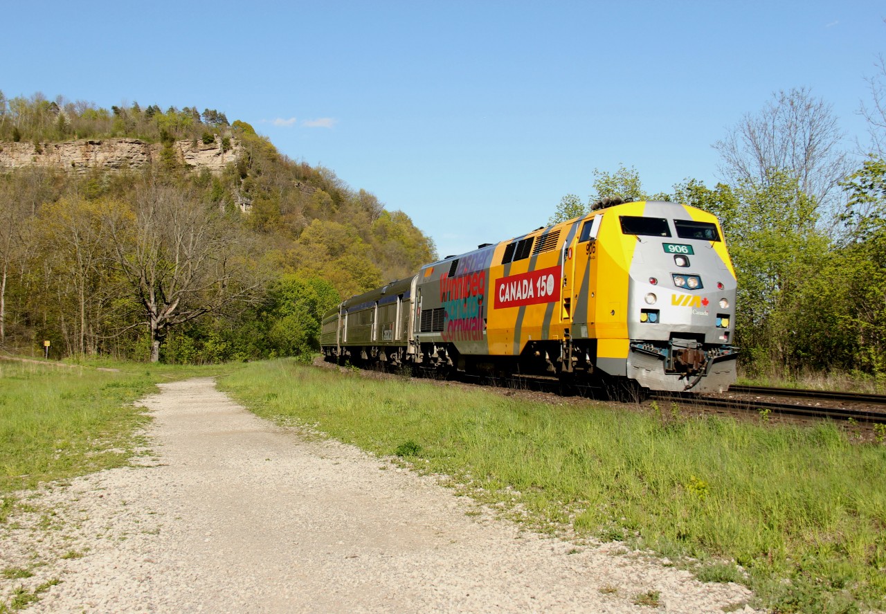 VIA 83 with Canada 150 wrapped P42DC #906 heads west past Dundas Peak on a beautiful May afternoon.