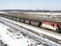Looking for all the world like a P.R. pose, the original London product has a good jag of Lasalle coke as the Port Colborne local exits the east end of the (then) new Welland tunnel. Algoma Steel's Canada Furnace Company will be the recipient of this product. In turn they will manufacture Merchant Pig Iron, some of which TH&B will carry in a reverse move, for consumer's like Brantford's Massey Ferguson foundry (Verity Works). All is well in the world this January day, as myself and Fred Gaines stand freezing our eyeballs on the highway 140 overpass. And yes, 71 sounded very nice charging up the grade !