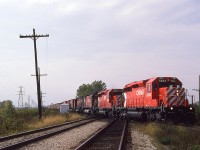 During another morning session at the diamond west of Chatham, I caught high priority train CP 904 with an over bundance of motive power. 5934-6039-4713-4725-4700-4702-4502-5529 hit the CN crossing at subdivision speed as they approach the west side of the city. I'm fairly certain the last 4 or perhaps 5, were on idle, or shutdown.
No matter, still makes an impressive sight.