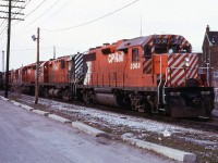 When CN Dundas station was reduced to Agent-only status in February 1973, I didn't have too many choices as to exercising my seniority. So I claimed 2nd trick at CN West Toronto with Tues & Wed off. Turns out I actually enjoyed that place. CP's Mactier Sub was on the opposite side of the building from CN's Weston Sub and a little warning of an impending move would be to have the gates come down for old Weston Road. Here we see timetable train 82 with two year old GP38AC 3008 in it's original paint leading a C-424, an SD40, an RS-10 and another C-424 as it passes the CN parking lot and gets ready to make the turn onto the North Toronto Sub. Just another quiet Saturday afternoon and evening in the meat packing district.