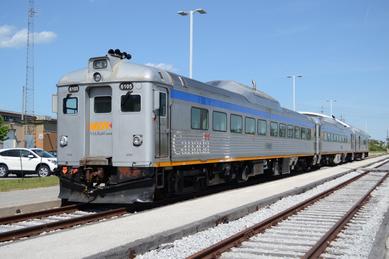 VIA 6105, VIA 6208, and VIA 6251 sit on track #1, at the VIA Rail Station in Windsor. On Tuesday May 23 to Thursday May 25, they will be doing round trips during the day from Windsor Station to a temporary Platform at the WFCU Centre, where the Memorial Cup CHL Hockey Tournament is being held. About 3000 Students in Grade 5 & 6, from Windsor & Essex County, will be doing some Rail Safety trips and also going down to the Arena for some educational stuff involved with the Veterans and other items.