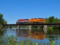 GEXR 516-02, led by the RLK 4095, GEXR 2303, coasts across the Speed River at Hespler on the former Fergus Sub as it heads for Galt.  Today 516 is too lift a schnabel car from Babcock & Wilcox; car no. BBCX 1000.  The train returned to Guelph this day and continued to CN rails at Georgetown and onto Hamilton the following day (July 3).  On July 4th it would be moved by the RLHH from CN Stuart to the harbour.  Taken along the former Grand River Railway right-of-way.