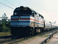 Amtrak unit #342 leads a 5 car train at a stop at Burlington West to pick up passengers.