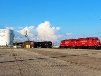 A pair of GP38-2's switches cuts of tank cars by the diesel storage tanks that feed the locomotive servicing area.