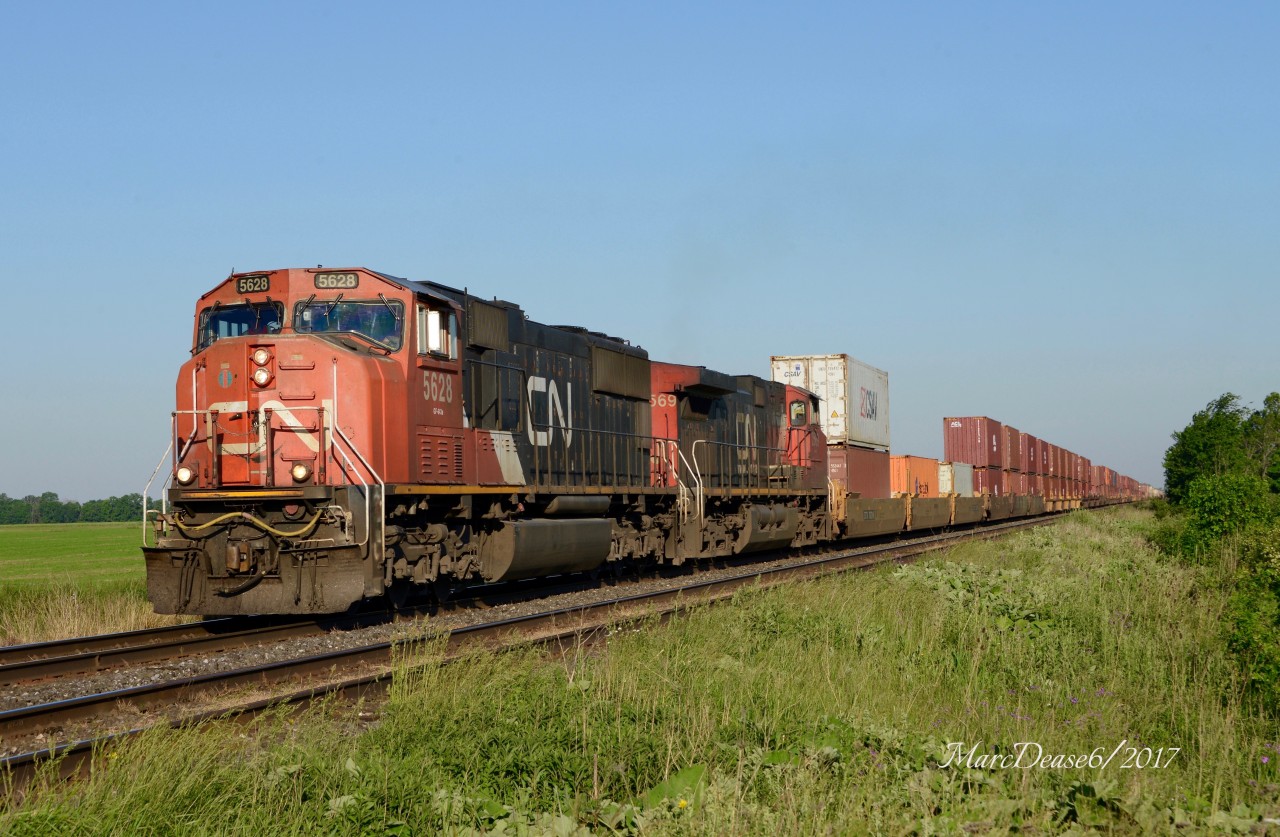Early mornings in June are just about the only time of the year to shoot from the north side of the tracks as Train 148 heads east bound out of Sarnia at Waterworks Side Road with CN 5628 and CN 2569.