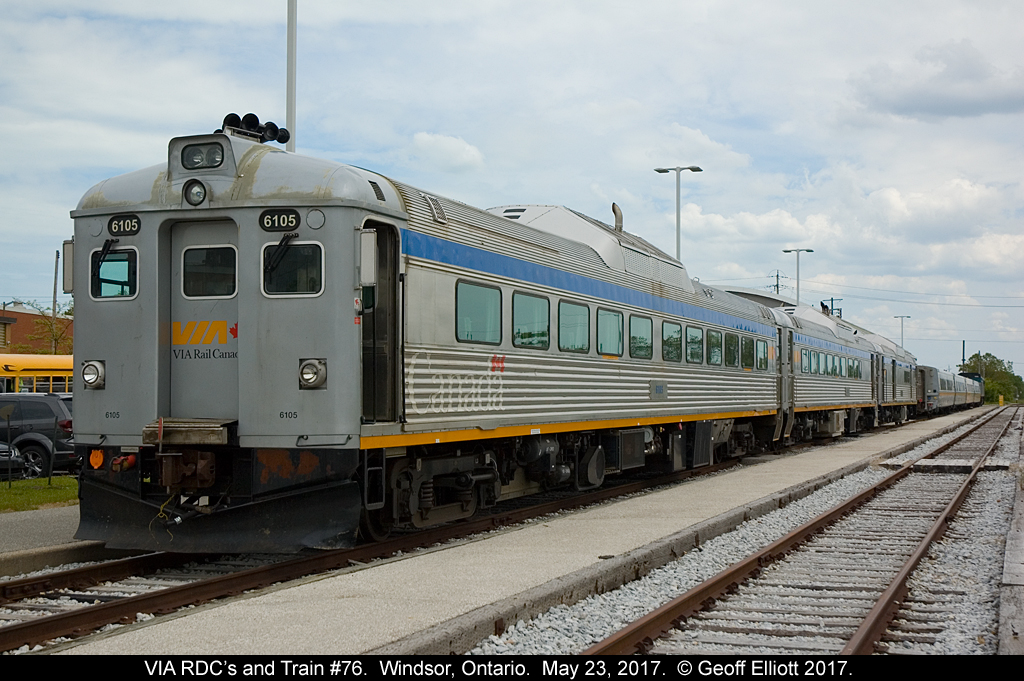A trio of rebuilt VIA RDC's are front and center at Walkerville (Windsor) Station today as VIA has brought the trio to Windsor as part of the Memorial Cup Tournament being held at the Windsor WFCU Center.  The RDC's are being used to shuttle school children from the station to the WFCU to view a display explaining the history and meaning behind the Memorial Cup.  In addition they teach the kids about railway safety along the way.  Great job by VIA in promoting this.  Behind the RDC's is VIA Train #76 getting ready to depart for Toronto at this time.