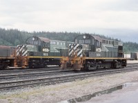 Idling away on the shop track on a gloomy May afternoon, 603 & 604 in the "two tone green" paint. These RS18 units were a popular reliable locomotive and well maintained by the BCR shop staff. Kind of a neat unit to operate on the main track in road switcher service with generally a good comfortable ride. In yard service they were great pulling locos for heavy switching assignments either as a single unit, or coupled in a pair or MU'd with a slug. Unfortunately they just weren't the same after the CAT engine conversion.