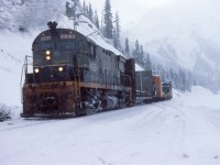 In work service for the day on the Tumbler sub. I can't really recall much of the activity that day, most likely we had dropped off a CAT bulldozer for snow plowing at Whitford siding. I do recall that I was not too comfortable pausing there as the area is a known avalanche zone. A gloomy winter afternoon, the mood of the crew matched the weather. The Roadmaster that was with us was not in a good mood either, perhaps not impressed with the progress of our work assignment. Such as it is on the railway.