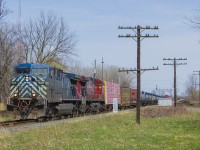 In a failed attempt at a time machine shot <a href="http://www.railpictures.ca/?attachment_id=28974"> (of Bruce Mercer's photo) </a> of the CP in action, I was able to capture CEFX 1045 in the lead this day entering Chatham at Princess Street. Notable changes - the tower at the interchange with the C&O is long gone, as is the diamond itself. Also gone too is the train order signal that is shown back in the distance on Bruce's photo. Only true way of marking such a photo is the telephone poles that still remain. No re-attempt here - "No Trespassing" signs have been posted by the CP as well as curious onlookers from the tenants of the house (out of photo) to the right of me. 