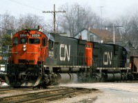 CN M636 2325 and C630M 2018 head west on the Dundas Sub through Paris Junction in April 1975. CN purchased many 4- and 6-motor mainline freight units from both GMD and MLW in the 60's and 70's, and the big M's were some of the largest MLW had to offer at the time.