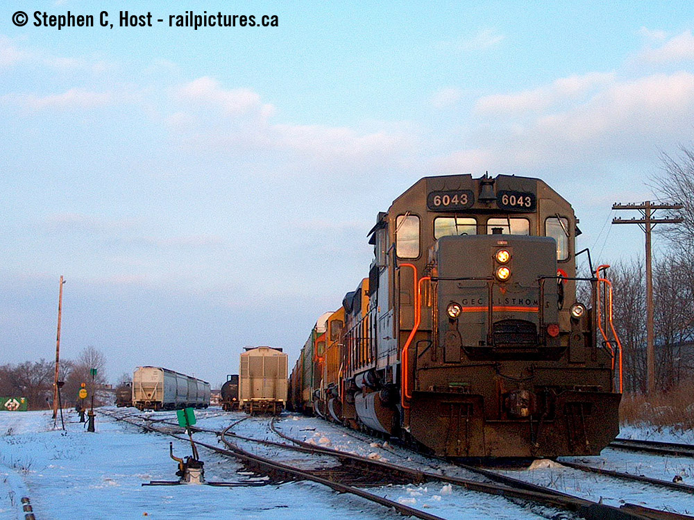 GCFX 6043, BNSF 2636 (Santa Fe paint, blue), and BNSF 2537 (Orange) on CN train 271 @ Kitchener. While taking this photo, and believe me, pure luck if anything turned out, this train had a meet with CN 434 and another CN Eastbound (I believe 148) who were item 7 between each other (radio block) and only a couple miles apart. GEXR 584 had also just come on duty and came to switch the yard while 434 was passing - it was a three way meet, which I do have on camera, but no, I did not shoot anything good. I hope one of the dozen railfans who was there this day can pull out some shots - because this was the only one that turned out for me :)
And if you want to talk about my oldies - this is it. You know that first camera you buy, which turns out to be nearly garbage and so are most if not all of your photos - this was my Hewlett Packard  C618 2 MP Optical Zoom point and shoot, 2 megapixel. I'm going to try and see if this photo turns out.. not many of them did.