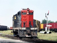 CN GP9 4508 is in charge of this wayfreight job, switching cars in the yard at Aylmer in the Summer of 1981.