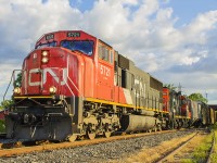 After getting a tip that this train was slowly moving through Chatham, I raced with anticipation of getting some decent photos of the CN within town limits. Having driven around for about 10 minutes, I finally caught the headlights of 5721 in the distance while crossing Sass Road. I pulled into the (unknown) factory parking lot, and took a position on the now abandoned siding. My goal was to photograph the train coming off of the MacGregor Creek bridge, with the signals showing on either side of the train while it coasted along the eastbound main.. However, without knowing until the train came off the bridge, they took the former westbound main! With CN 5721 leading and 4071 trailing as the second unit, this train quite literally pulled a 'switch' on this photographer! Sometimes you just have to roll with the punches. 