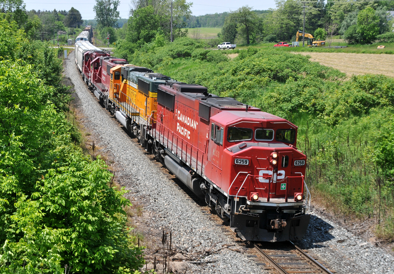 234 has just crossed Highway #2 on the west side of Woodstock, ON with CP 6259, BNSF 9980, CP 6249, and CP 2257 leading the way with 100 cars. It was a nice change to see a solid EMD consist on CP for a change!
