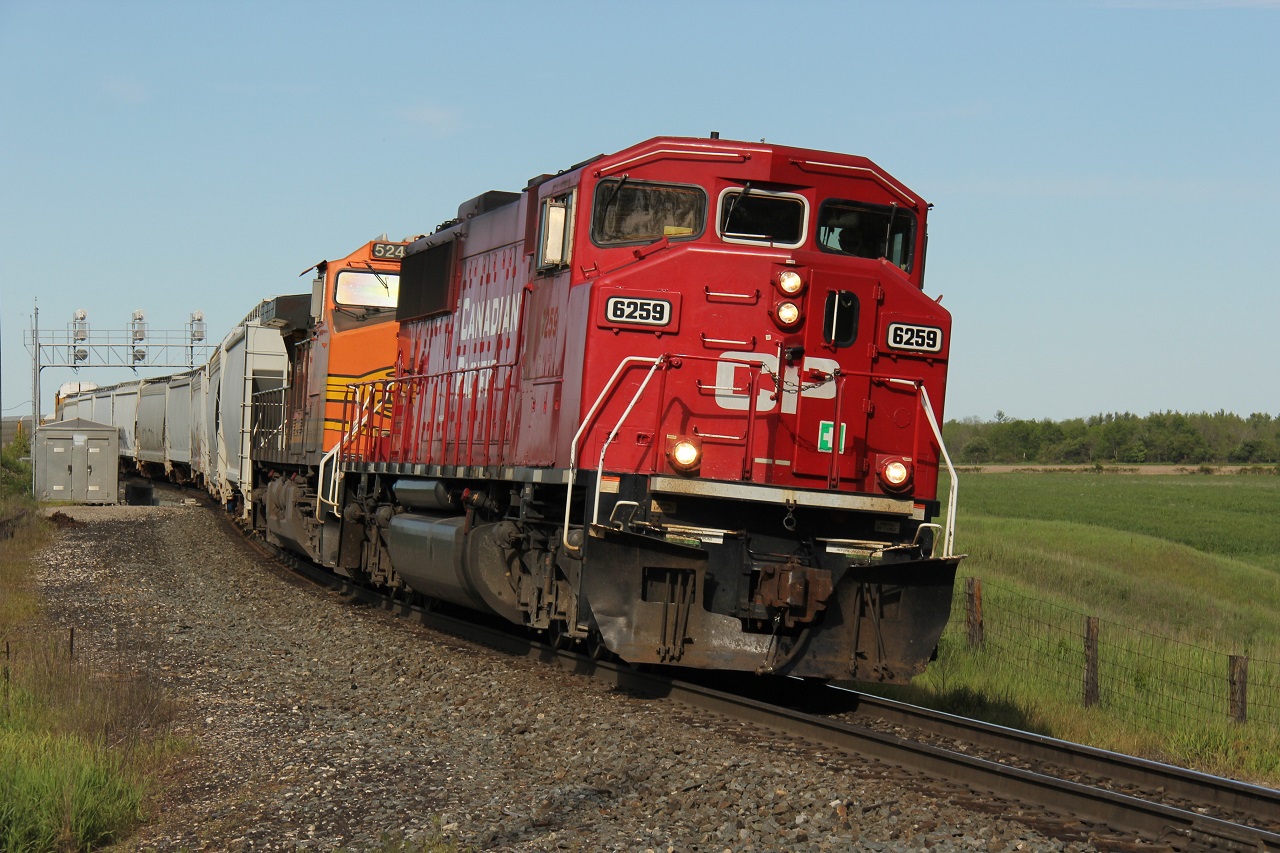 It's been a while since I got the opportunity to shoot CP 147 with interesting power. I have not shot a CP SD60 wide cab ex-SOO locomotive in a long while so this was an opportunity I seized. Here is 147 with CP 6259 and BNSF 5248 on the point on a gorgeous Friday afternoon. According to locomotive tracing, it arrived in Wolverton at 1649. It departed just over an hour later, at 1756, after completing its work at Wolverton. I thought it may be a long shot since I departed Hamilton around 1645. But, I planned my route carefully and took a real backdoor way to get to the west end of Wolverton from all the way east at Highway 6, beginning on Safari Rd :) (side note: the 401 was gridlocked from Hwy 6 North Guelph so that was not an option at all!).