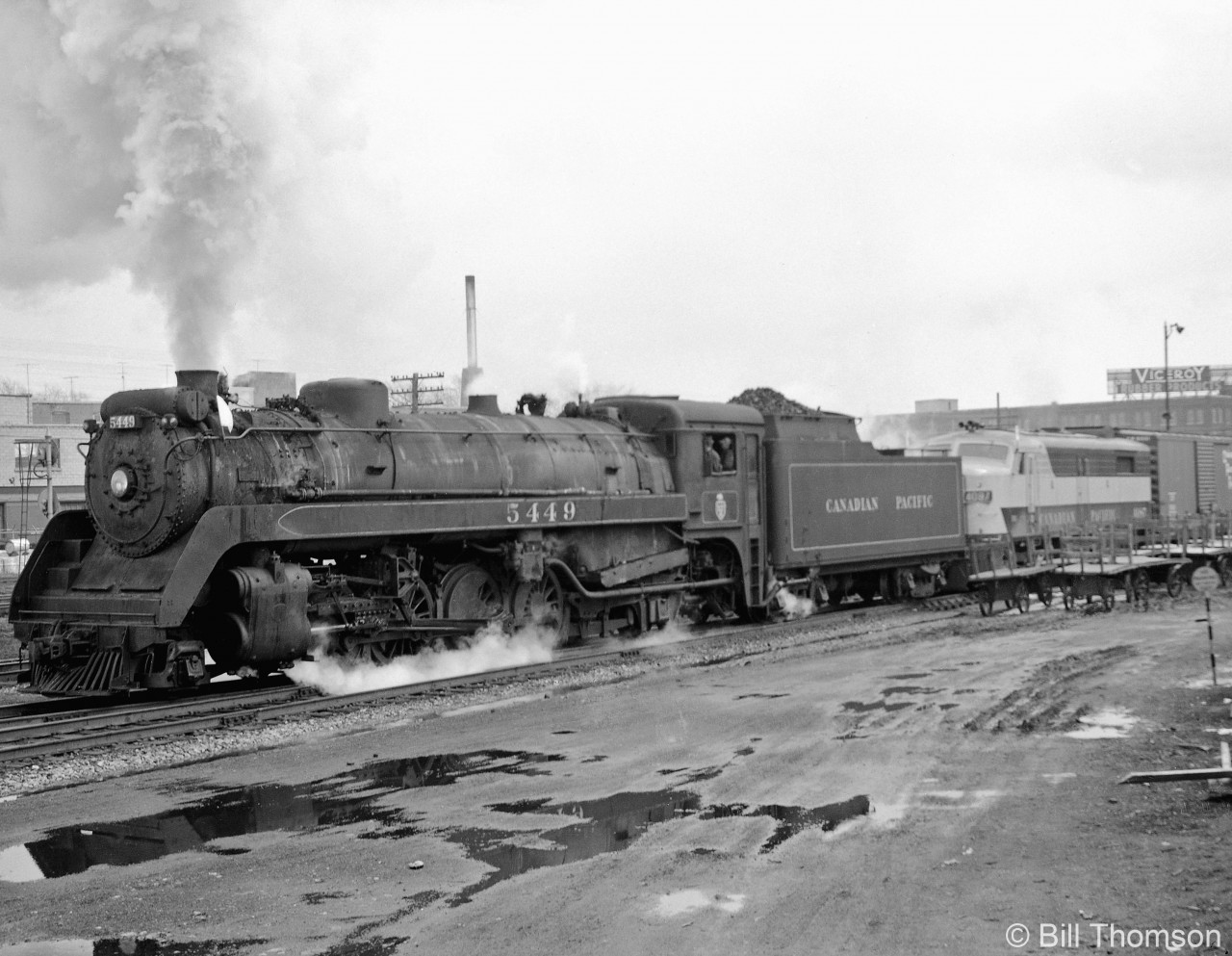 Canadian Pacific P2j-class Mikado 5449 is assisting MLW FA2 4087 on train #953 north to MacTier, shown at CP's West Toronto station before crossing the diamonds via the connecting track from the Galt Sub to the MacTier Sub. Diesel and steam power working together was a frequent occurance at the end of the steam era on CP.