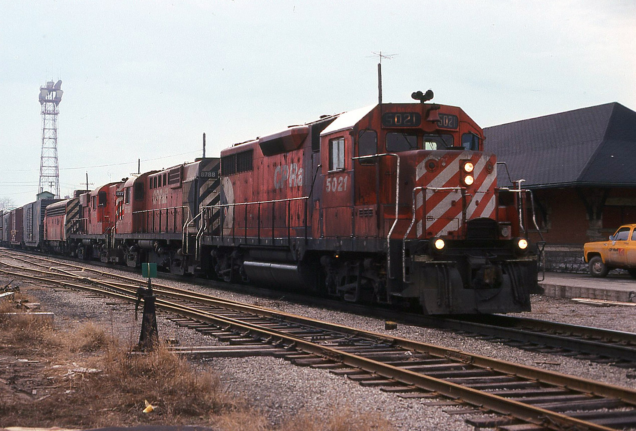 On a snowless day in February 1981, I caught this eastbound ( ? train 904 perhaps) with GP35 5021 leading a pair of RS18's and F7 4036. The CPR brick station is still standing in this image,  but it would soon be relocated to Fred's Nursery on McNaughton Ave East ( by 1983, brick by brick). I see a recent story that the new owners of that nursery were trying to resell the station (sad).