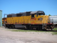 Basking in the sun in the small Goderich yard while two mechanics work inside the cab.