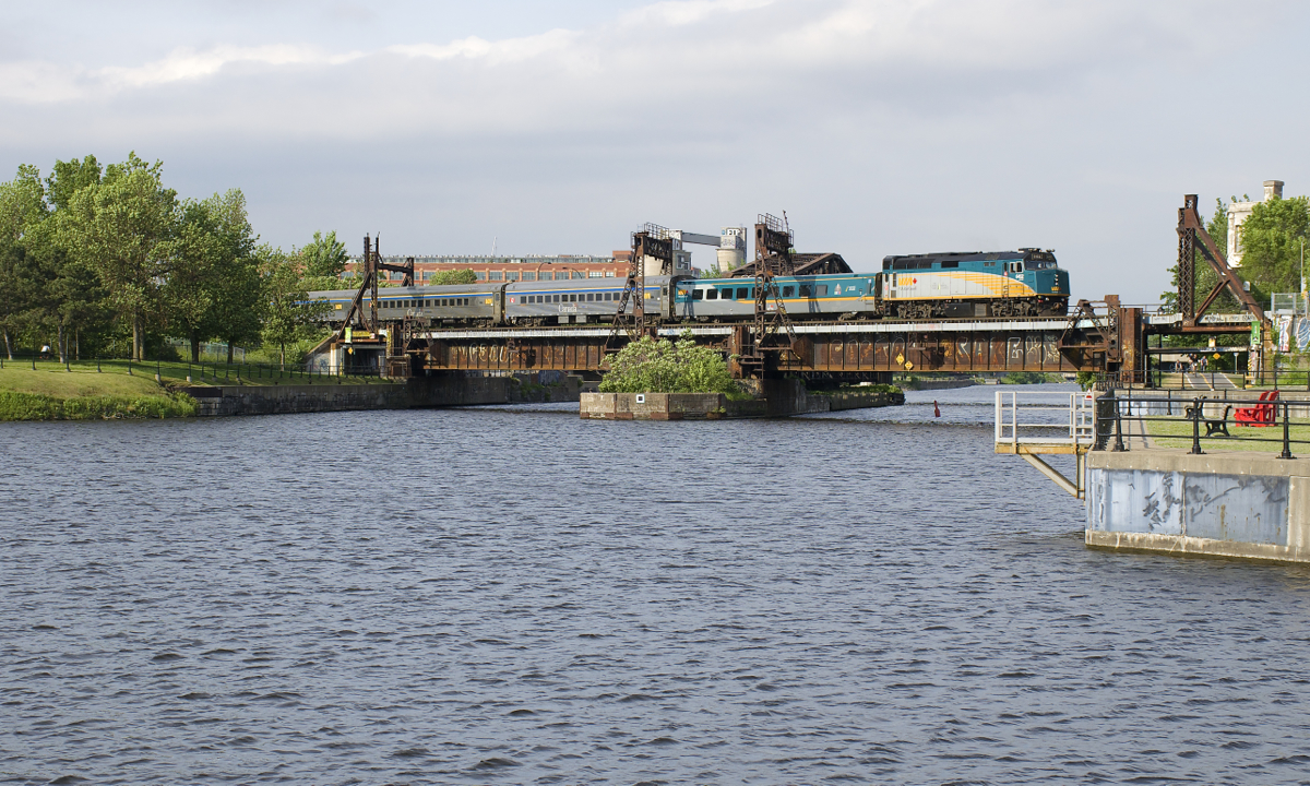 VIA 22 is led by VIA 6452 as it crosses the Lachine Canal with a mixed consist.